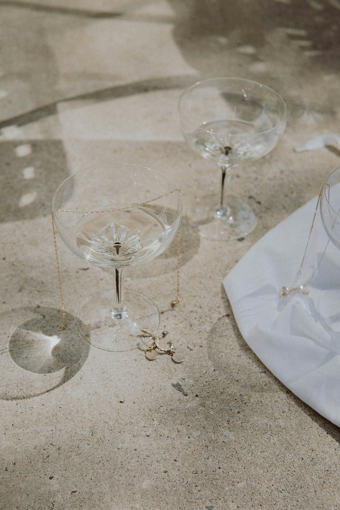clear wine glass on white table cloth