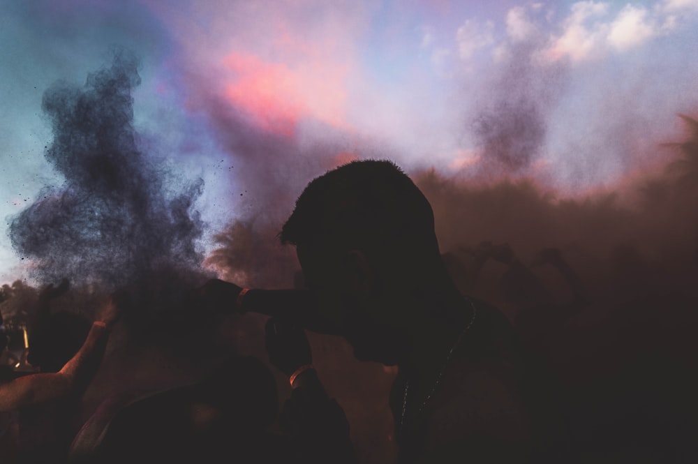 silhouette of man smoking cigarette