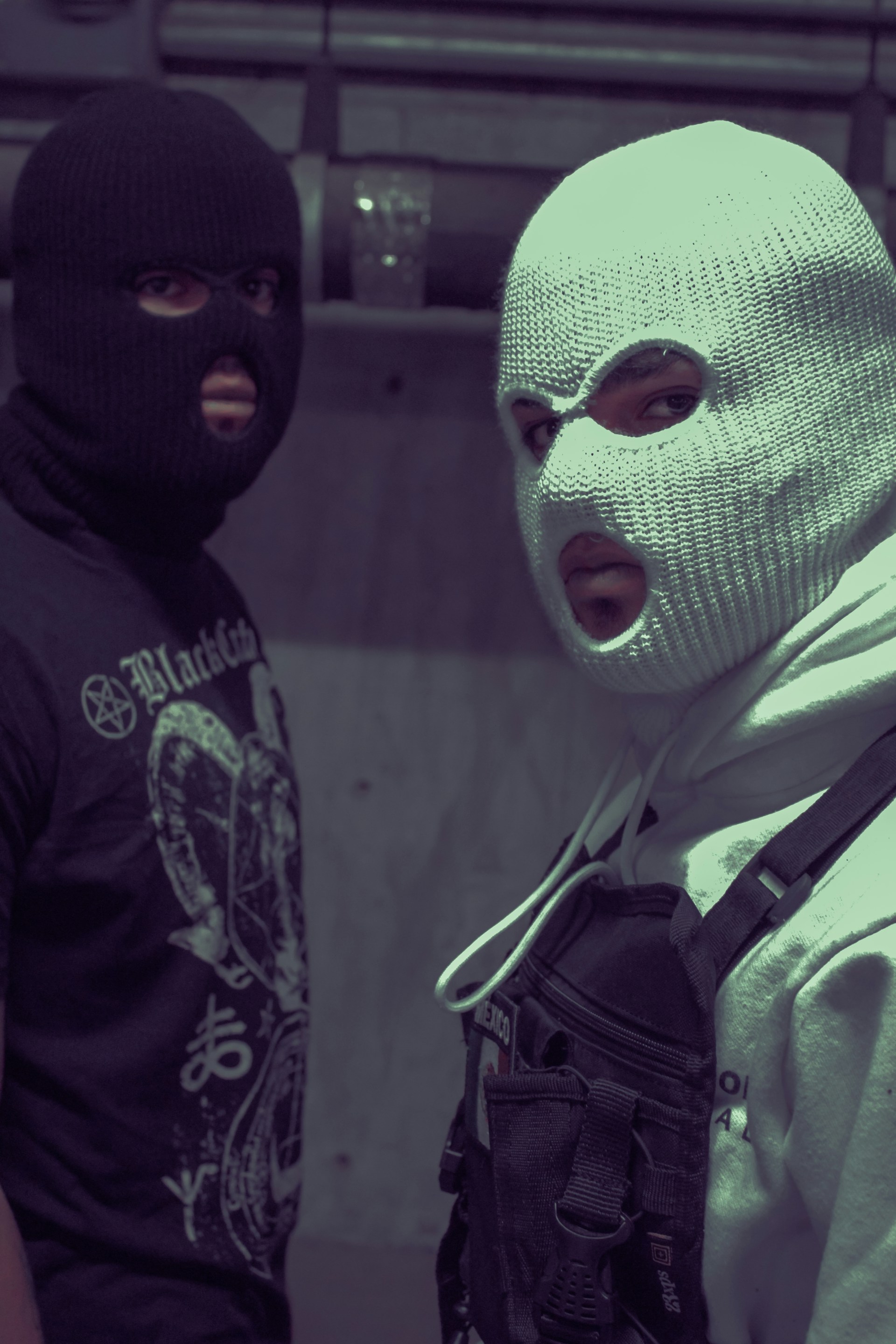 man in black and green mask