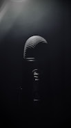black microphone on black background