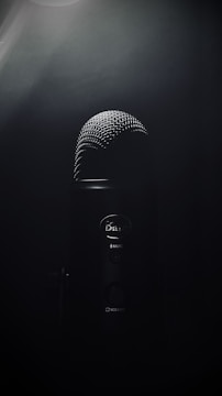 black microphone on black background