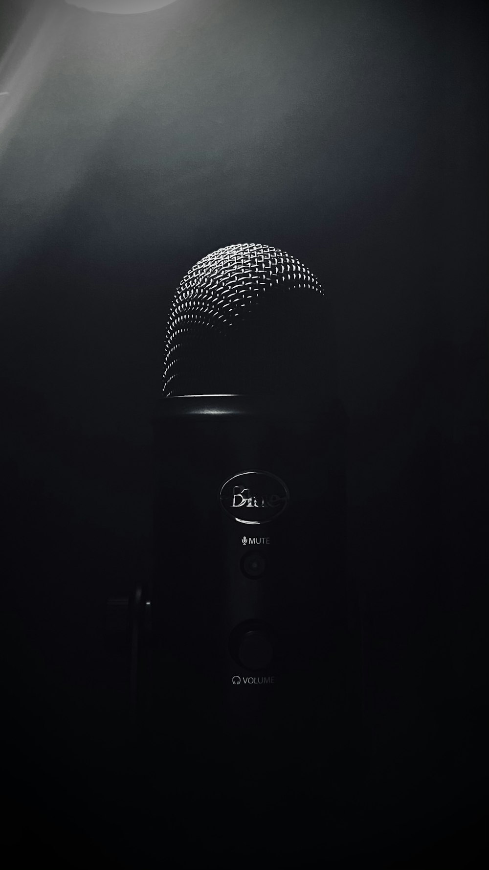 black microphone on black background