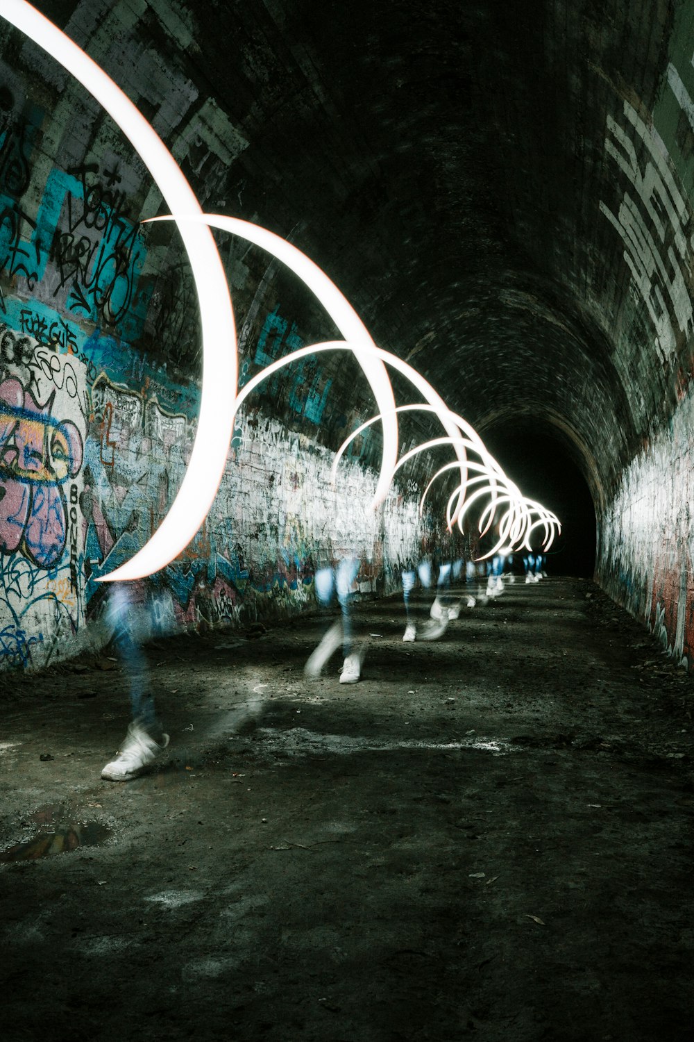 person walking on tunnel during daytime