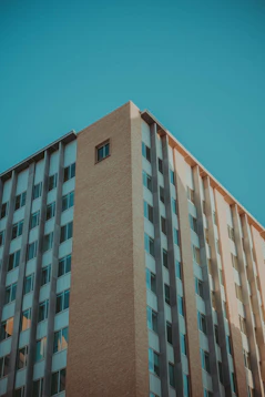 brown concrete building under blue sky during daytime
