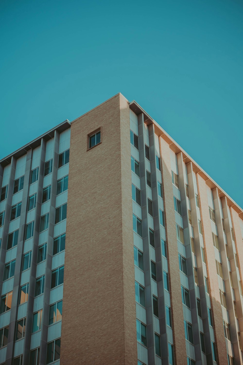 brown concrete building under blue sky during daytime