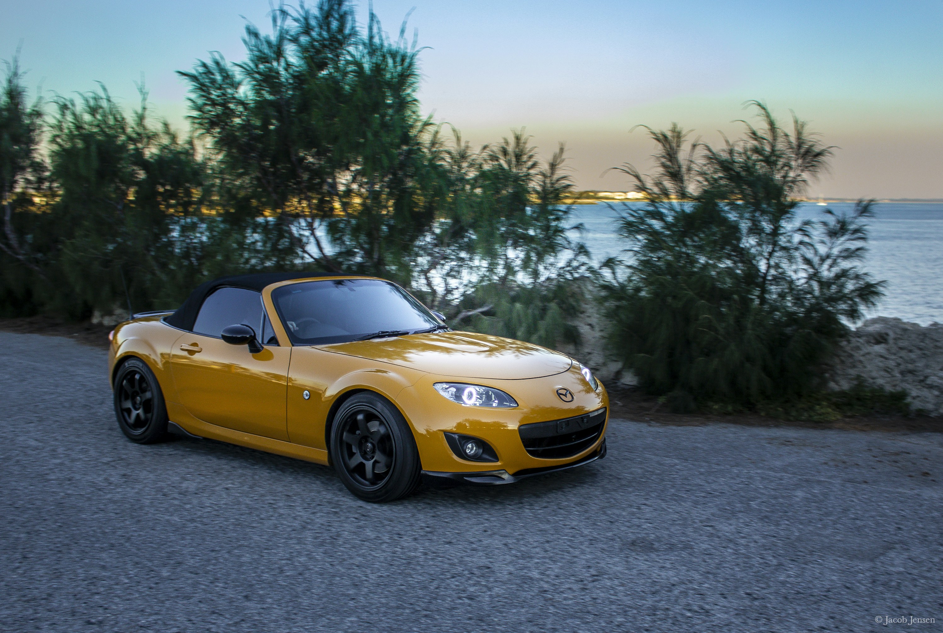 yellow chevrolet camaro on road during daytime