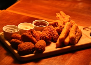 fried food on brown wooden tray