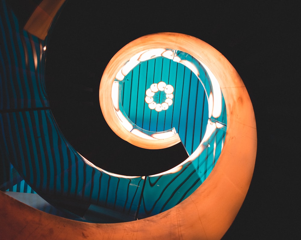 spiral staircase with blue metal railings