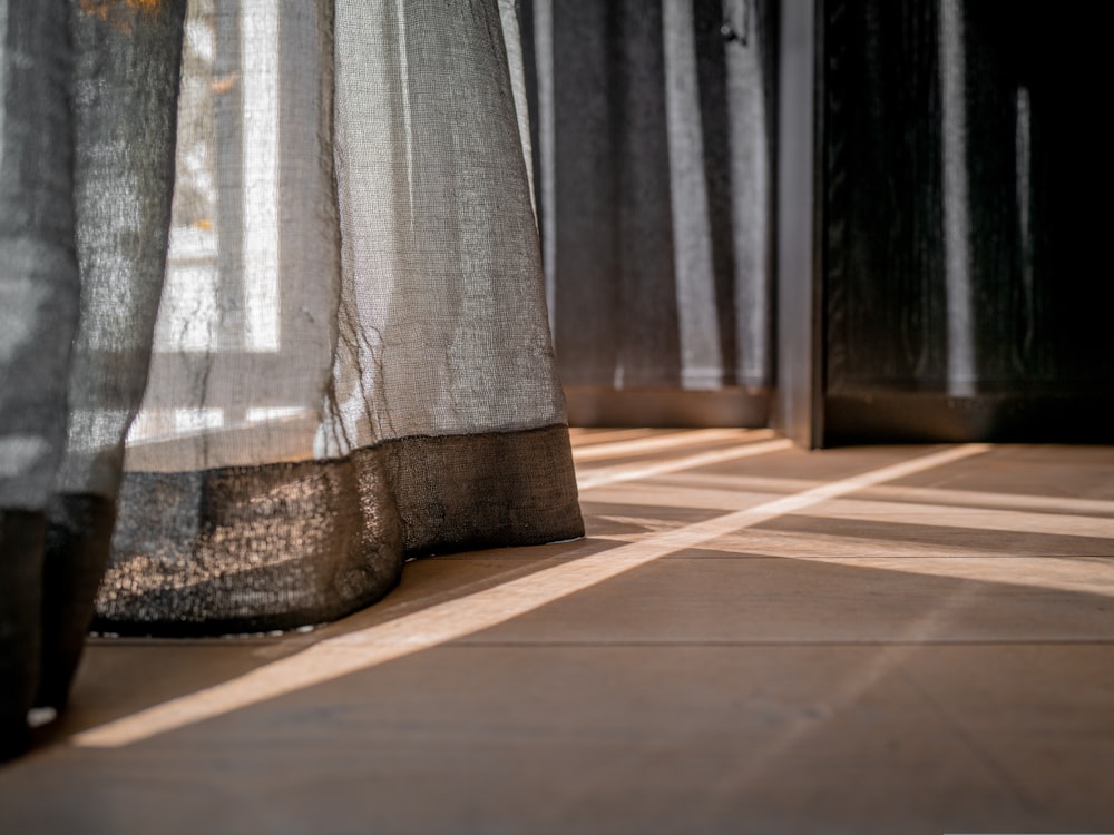 a close up of a curtain on a window sill