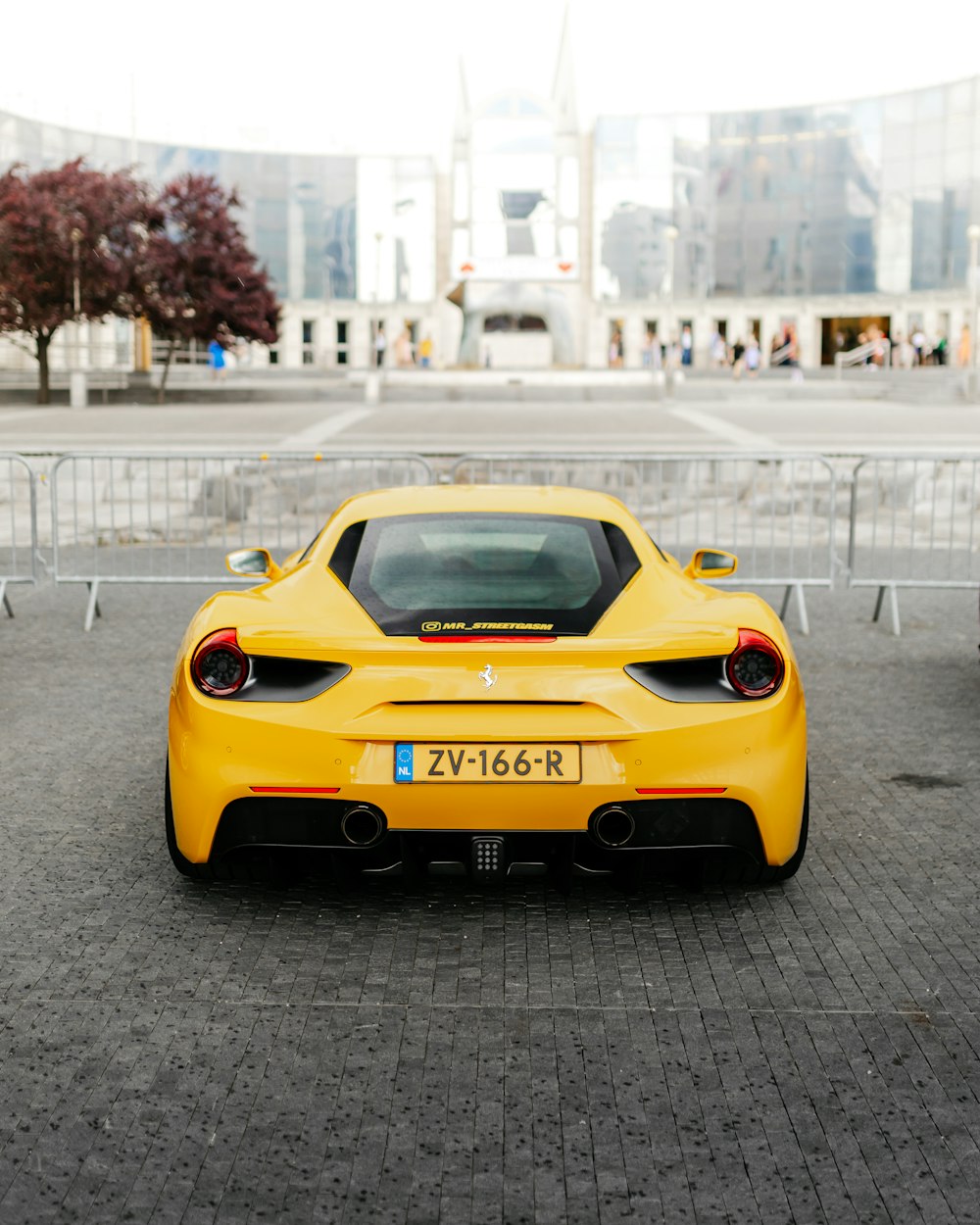 yellow porsche 911 on road during daytime