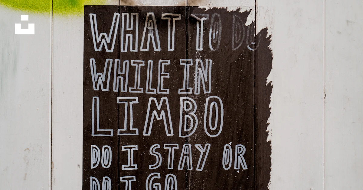 A sign on the side of a building that says what to write in limbo photo ...