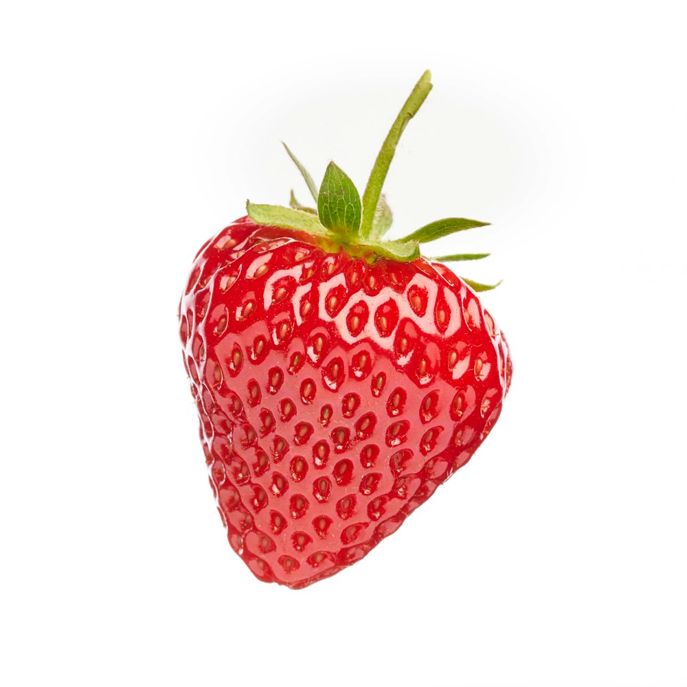 red strawberry fruit on white background