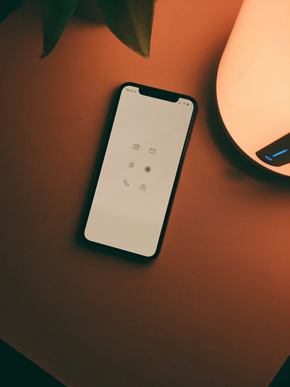 white remote control on brown wooden table