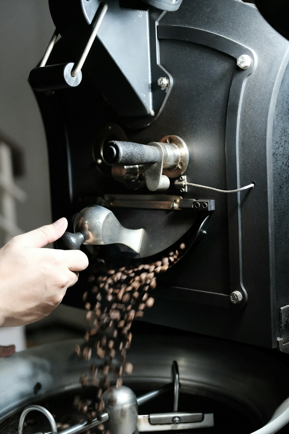 a person is pouring coffee into a machine