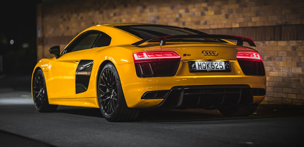 yellow porsche 911 on road during daytime