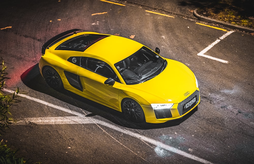 yellow porsche 911 on road during daytime