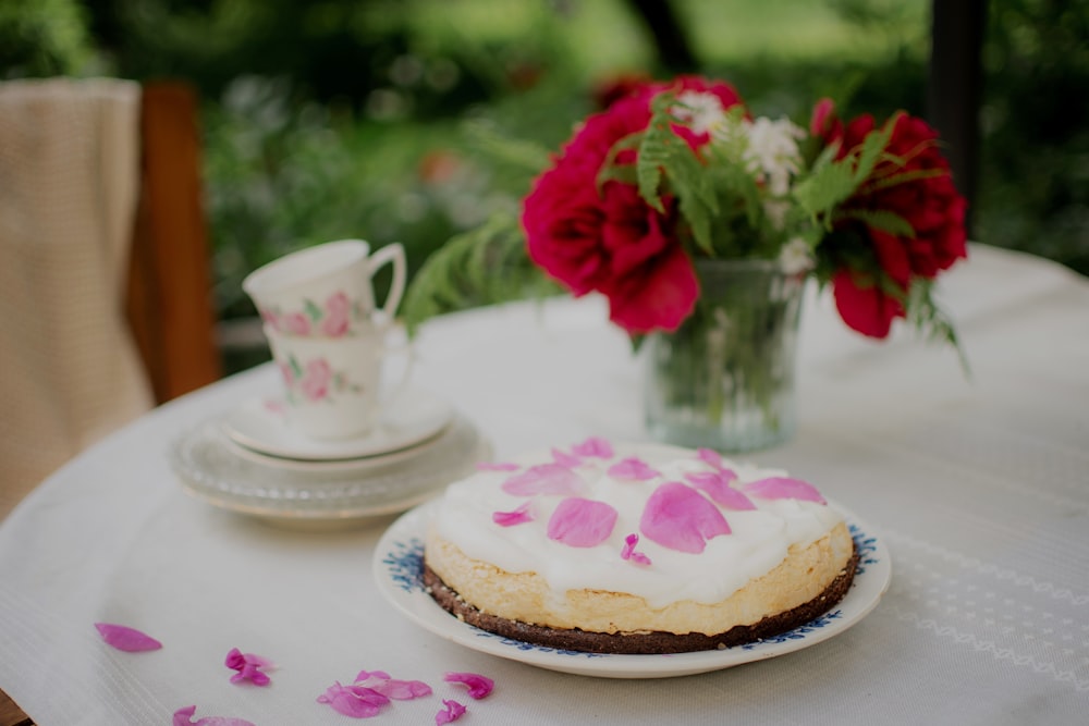 red rose on white ceramic saucer