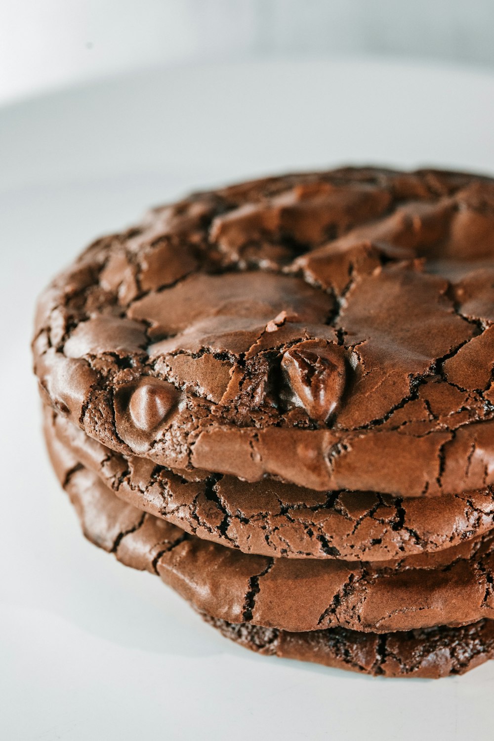 brown chocolate cupcake on white surface