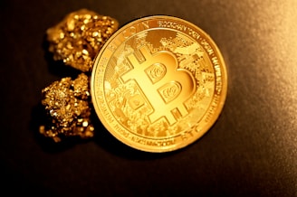 gold round coin on black textile