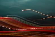 An abstract photo of light trails symbolizing data flow and technology.