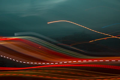 Abstract digital art featuring flowing light trails and holographic textures.