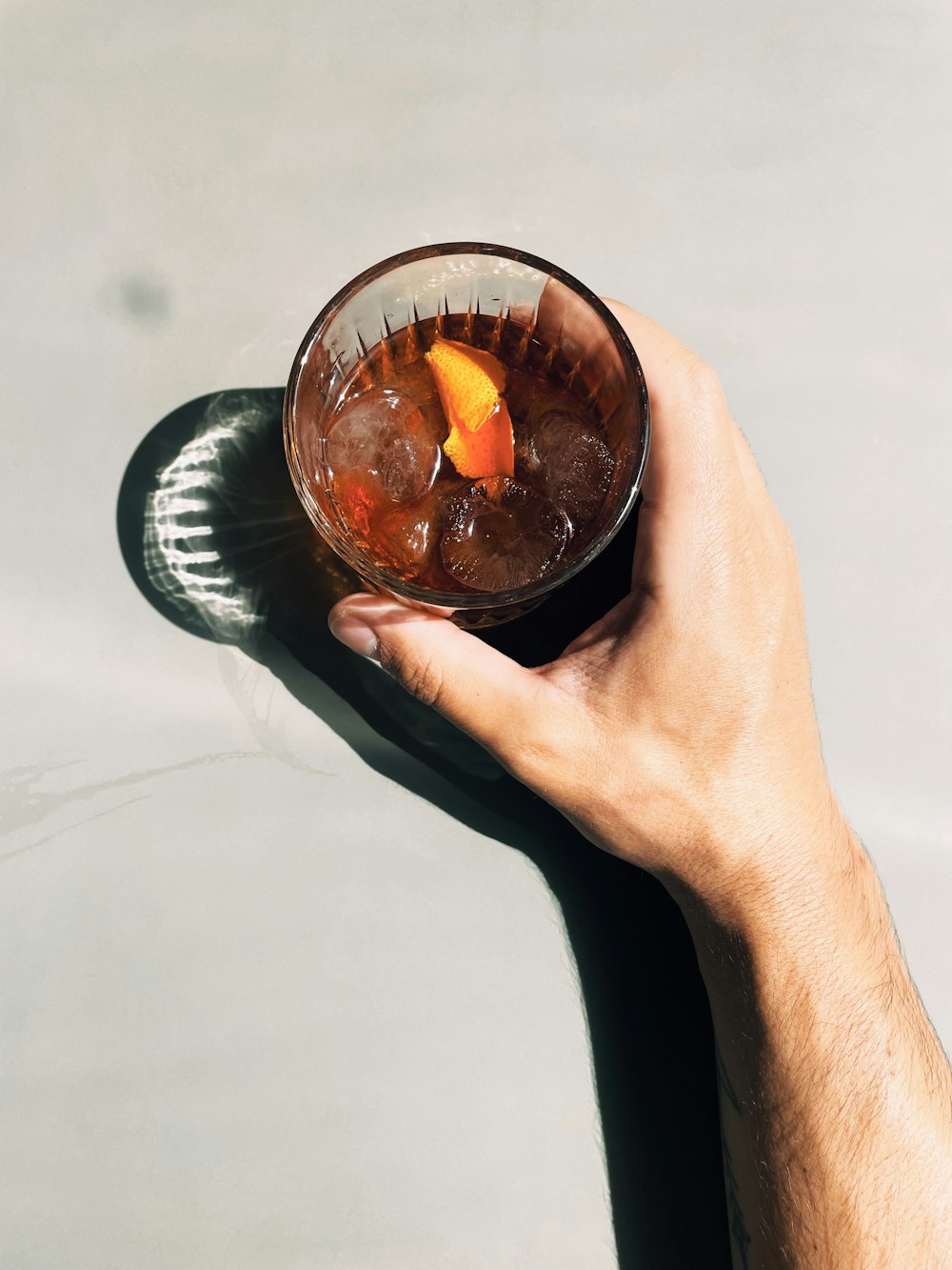 clear glass bowl with orange liquid