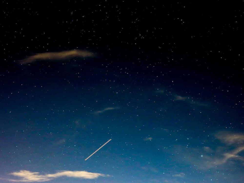 blue sky with white clouds during night time