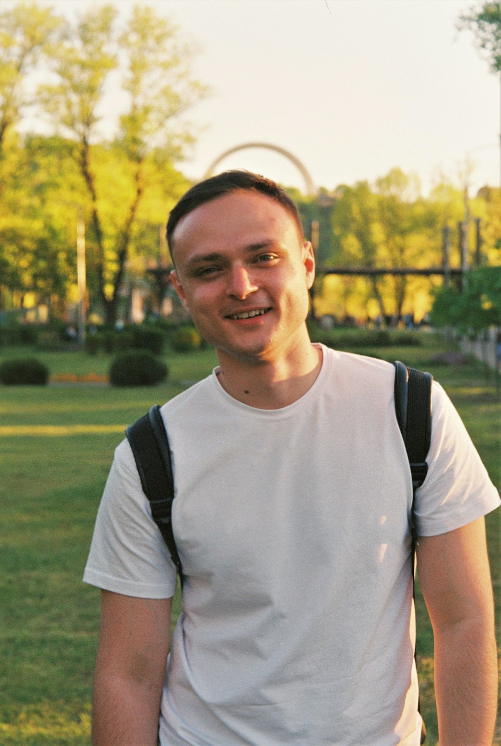 man in white crew neck t-shirt smiling