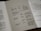 A close-up view of a printed pamphlet featuring a table with columns labeled 'Fault', 'Cause', and 'Remedy'. The table includes text about camera settings and photography issues such as exposure and focus. There is an adjacent column titled 'order form' with spaces for personal details like 'Name' and 'Number of slides'. The text is in a simple, clean font.