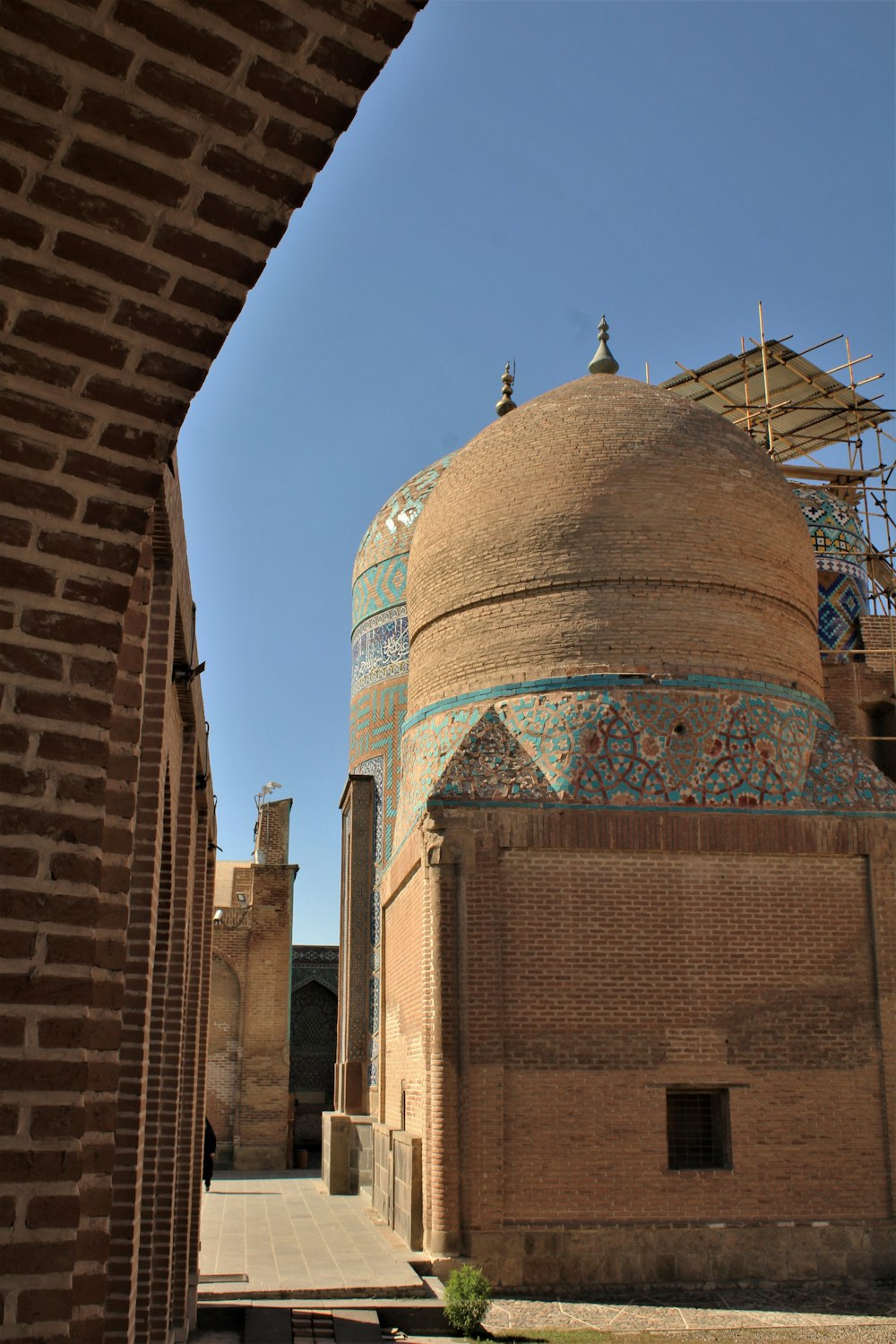 brown and blue dome building under blue sky during daytime