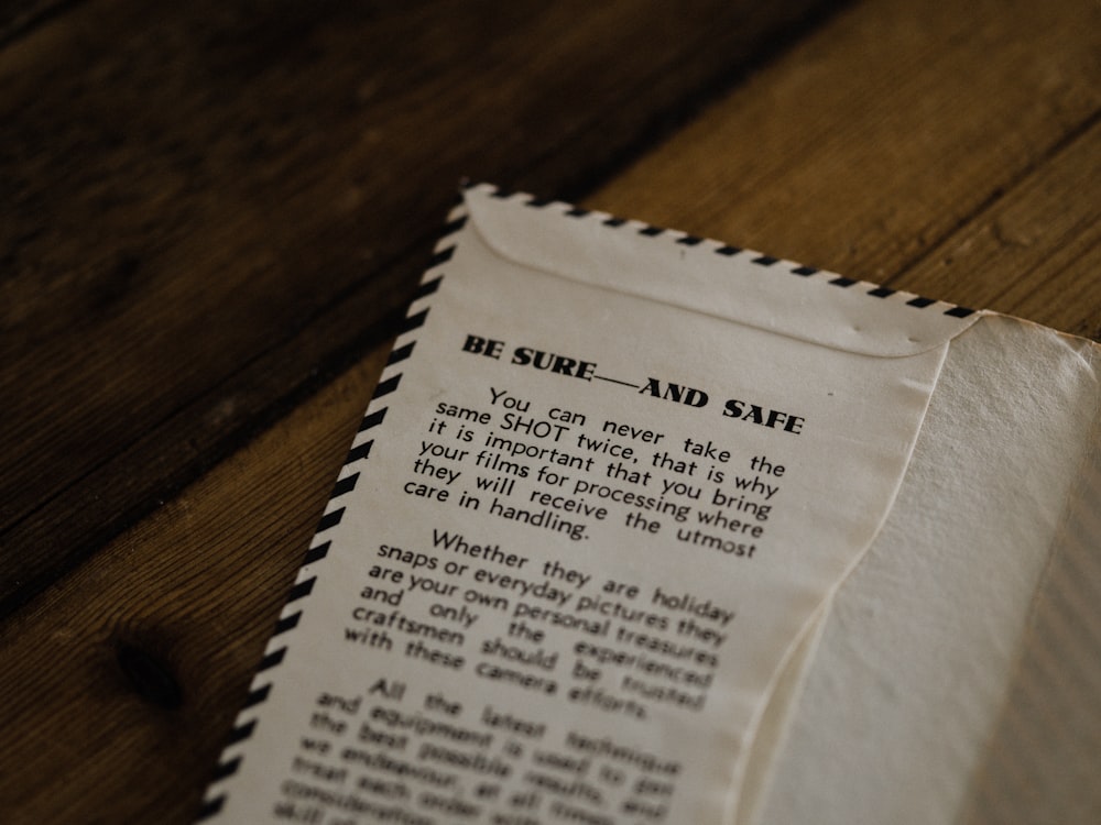 white paper on brown wooden table