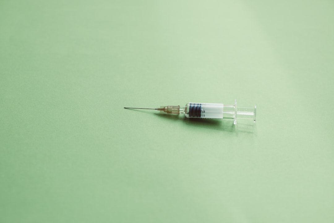 white and clear plastic tube, Syringe for vaccination