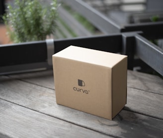 brown cardboard box on brown wooden table