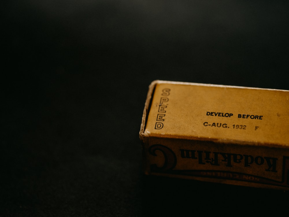gold and black labeled box