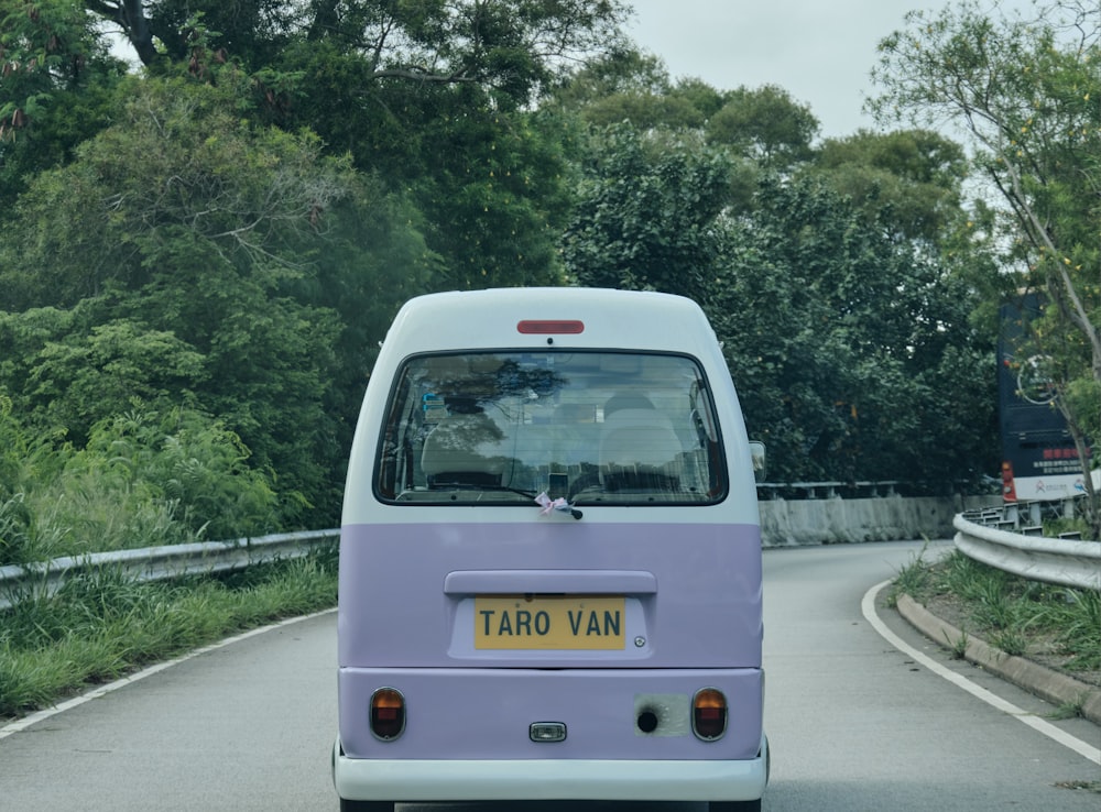 white and yellow van on road during daytime