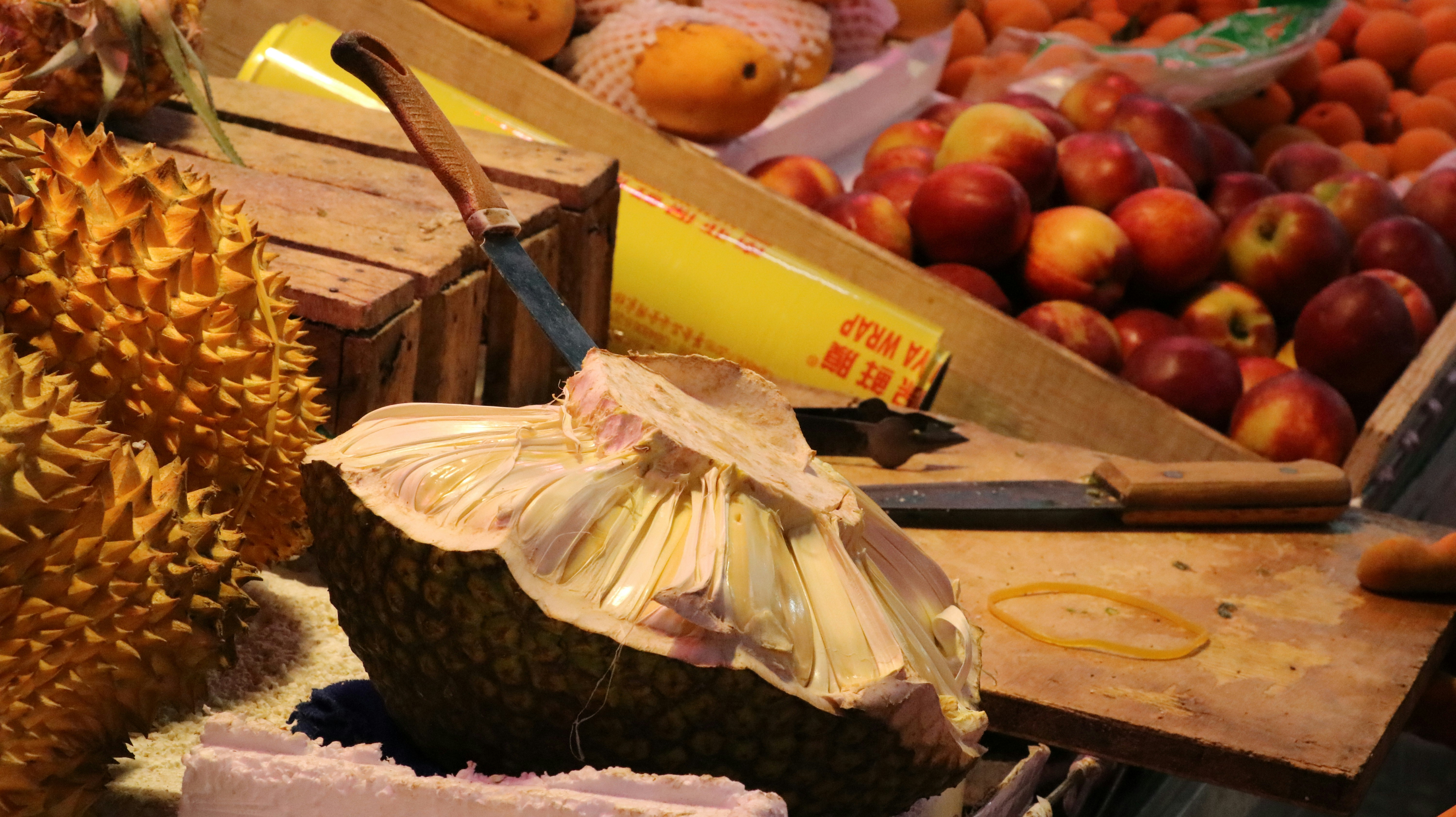 yellow and red apples on brown wooden table