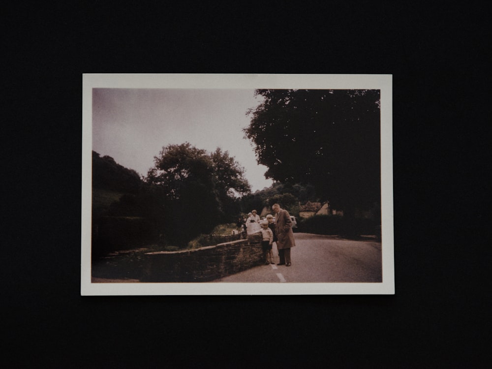 a group of people walking across a bridge