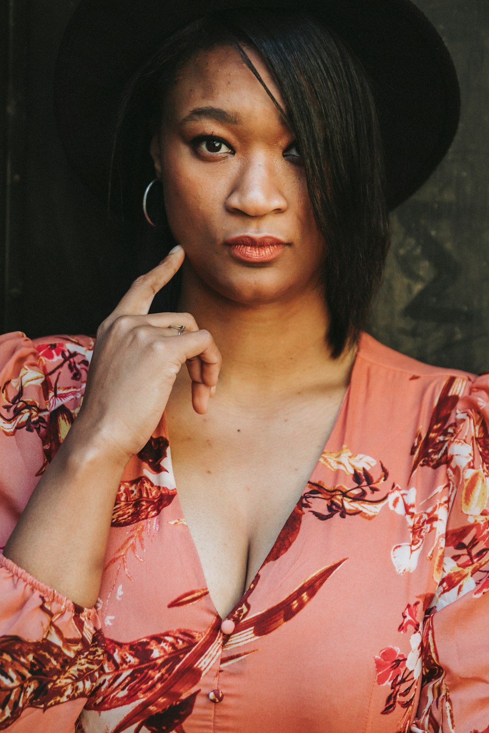 woman in red and white floral shirt