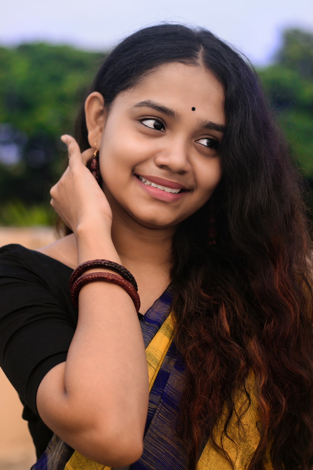 woman in black shirt smiling