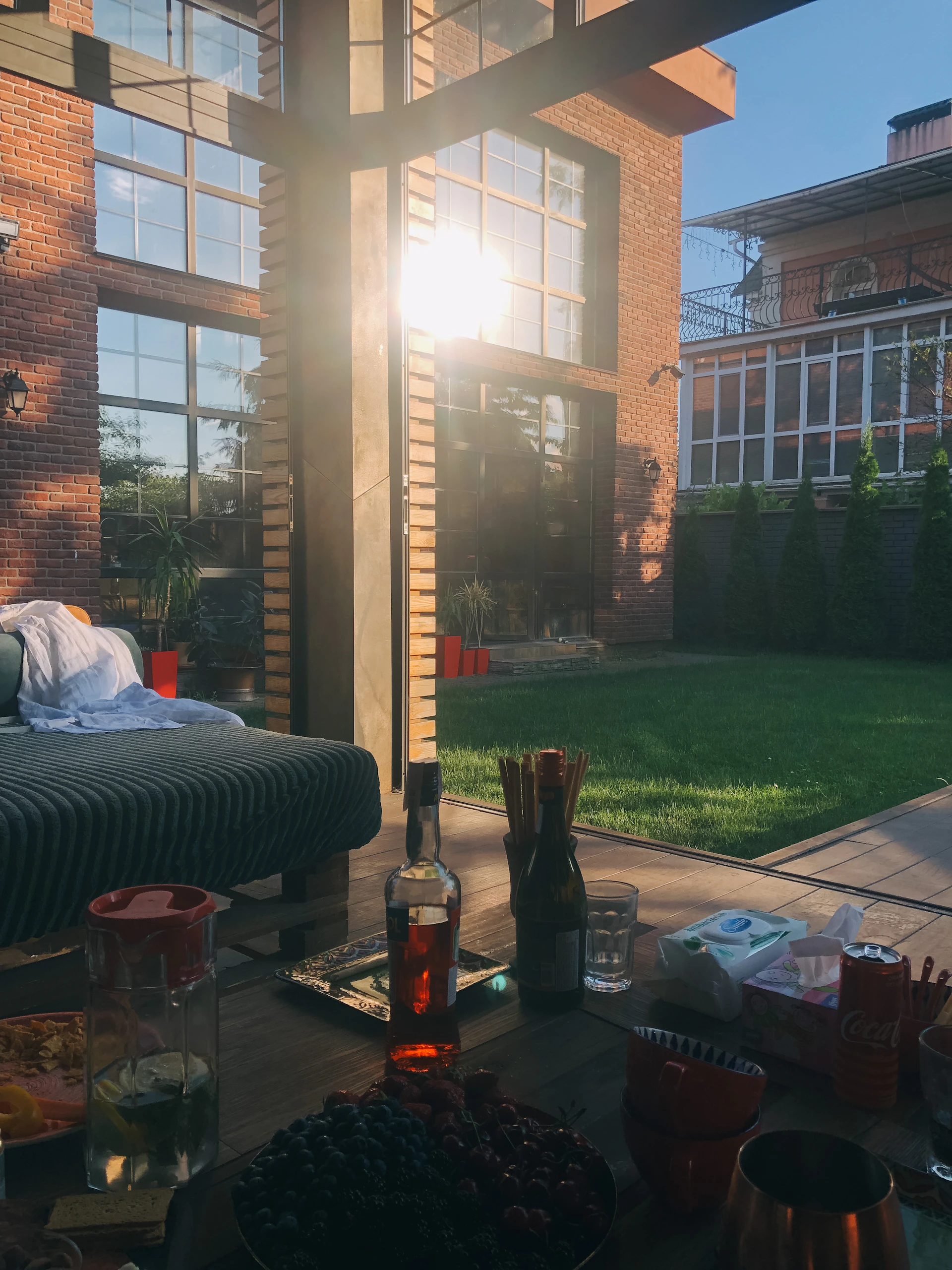 An outdoor scene featuring a cozy patio setup with premium cushions and accessories, ideal for relaxed weekend mornings.