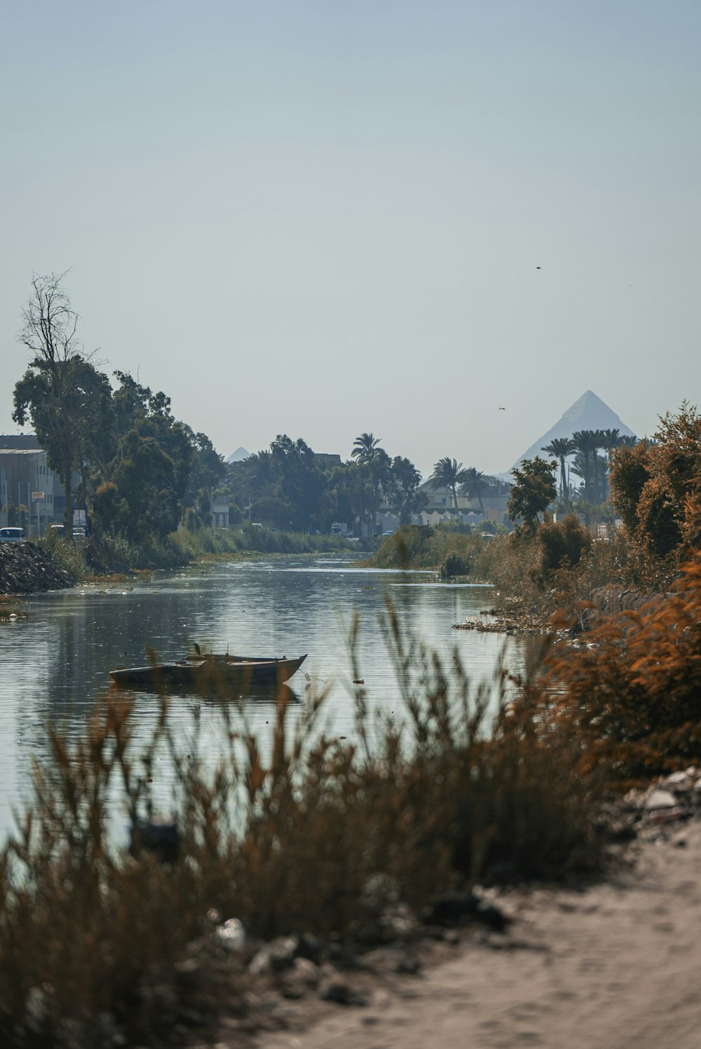 people riding on boat on river during daytime