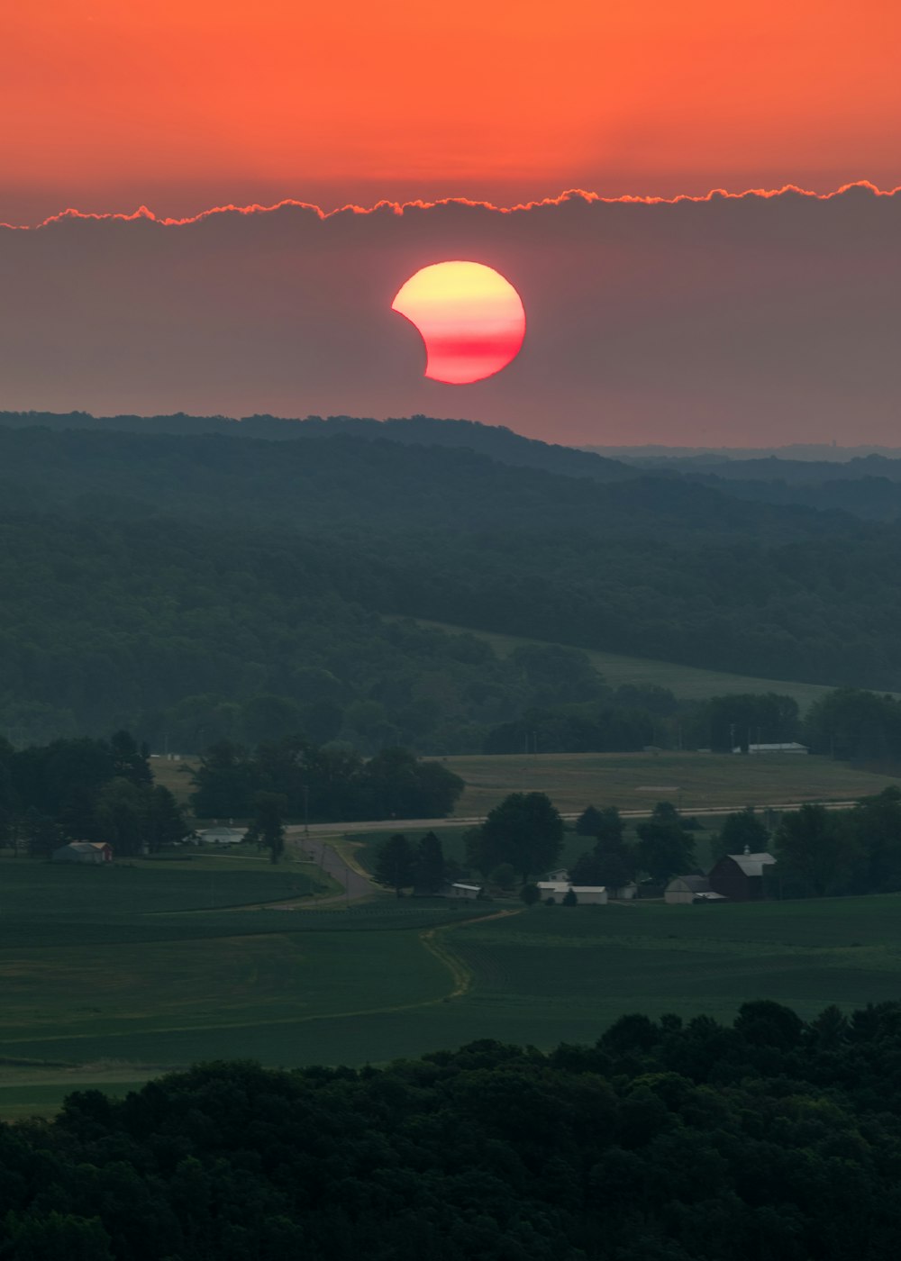 green grass field during sunset