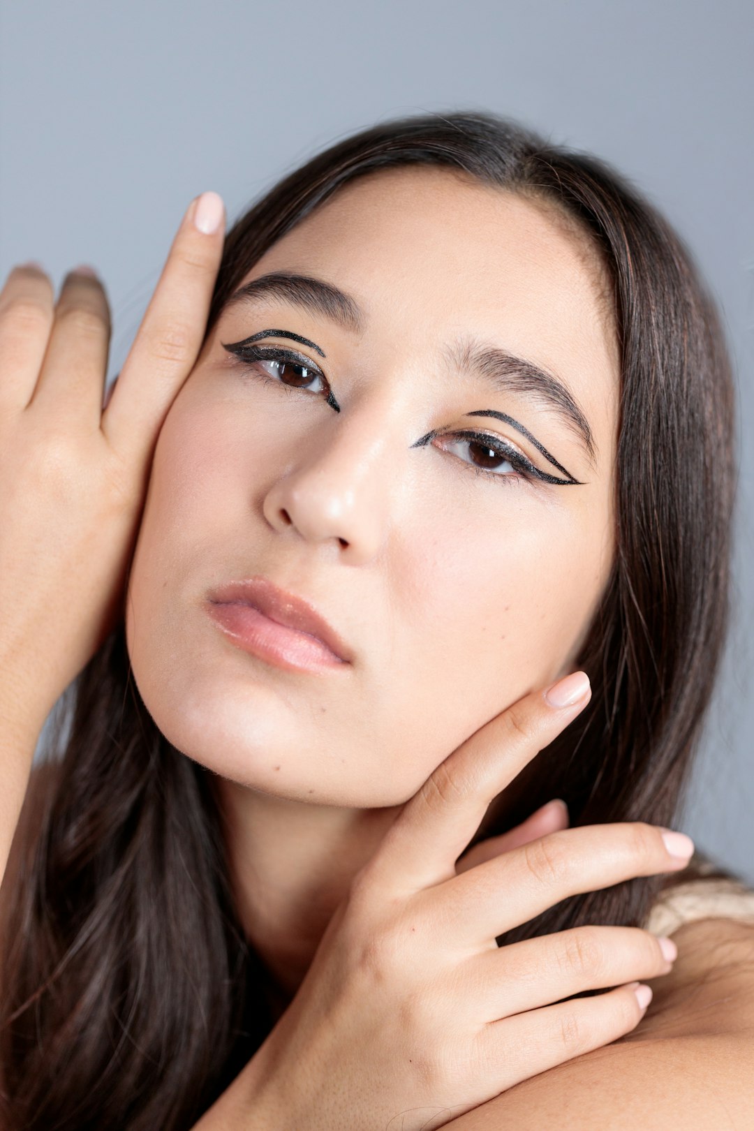 woman with red lipstick and black mascara