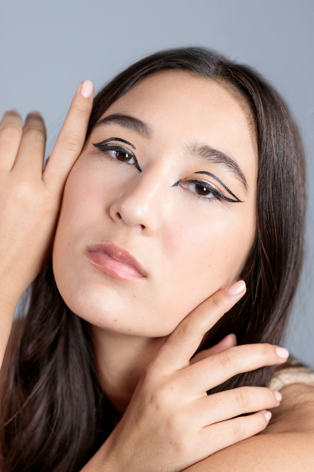 woman with red lipstick and black mascara