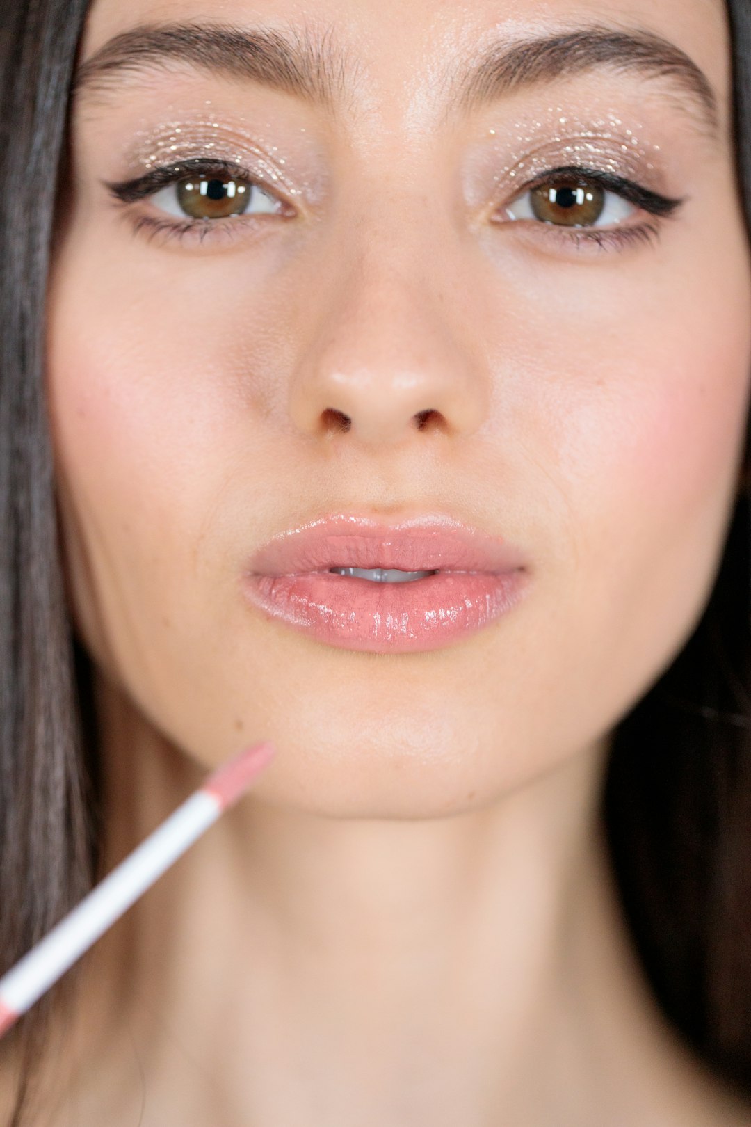 woman with red lipstick and black mascara