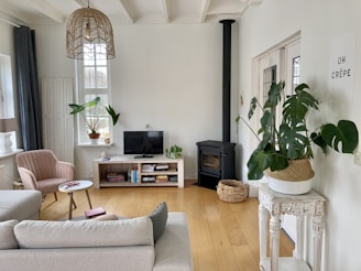 black flat screen tv on brown wooden tv rack