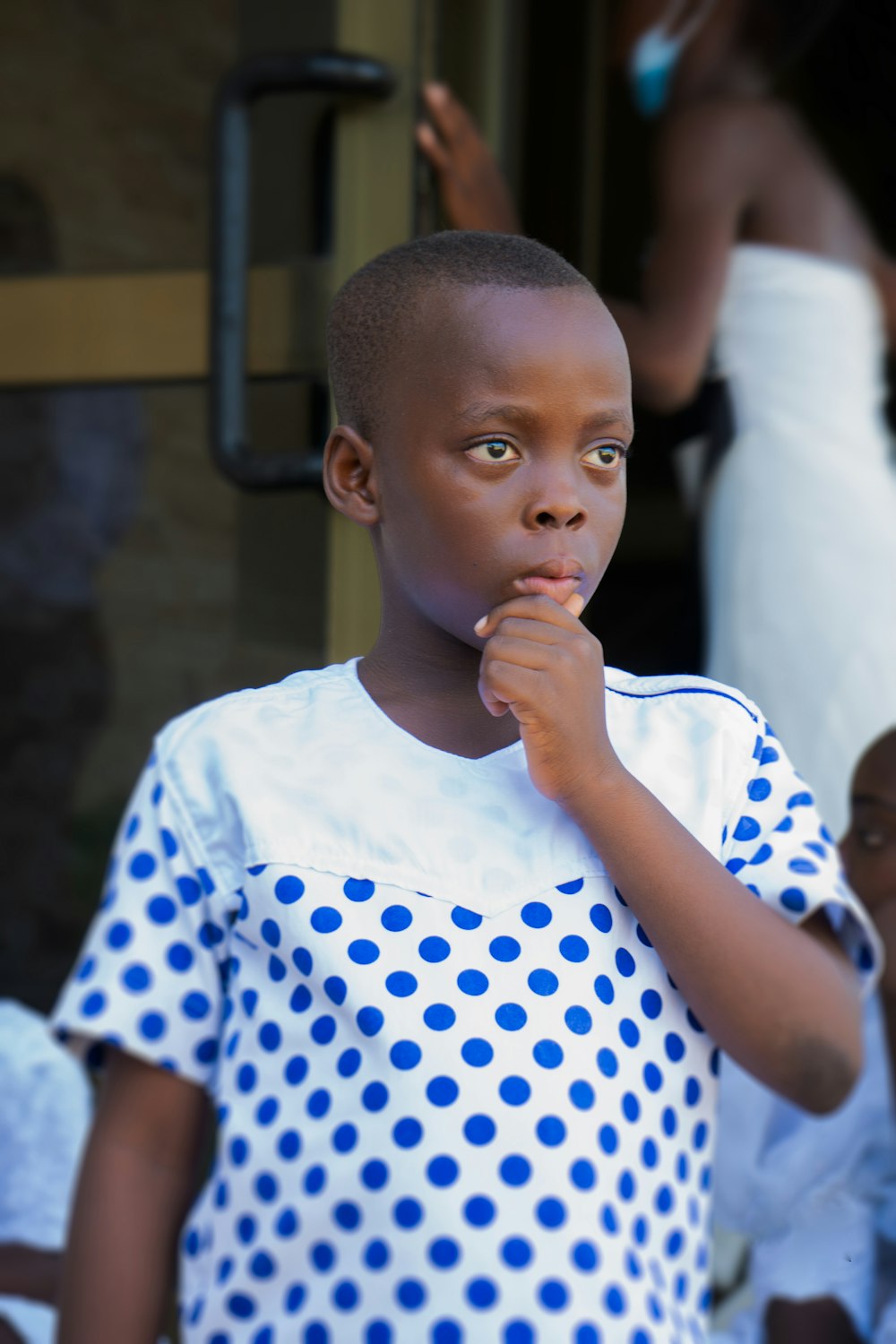 boy in white and blue polka dot crew neck t-shirt