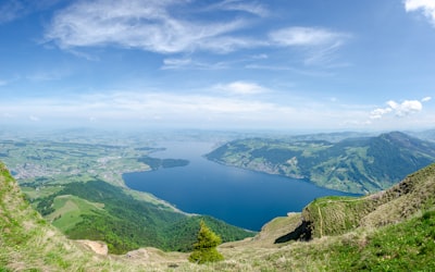 aerial view of green mountains and blue sea under blue sky during daytime fascinating google meet background