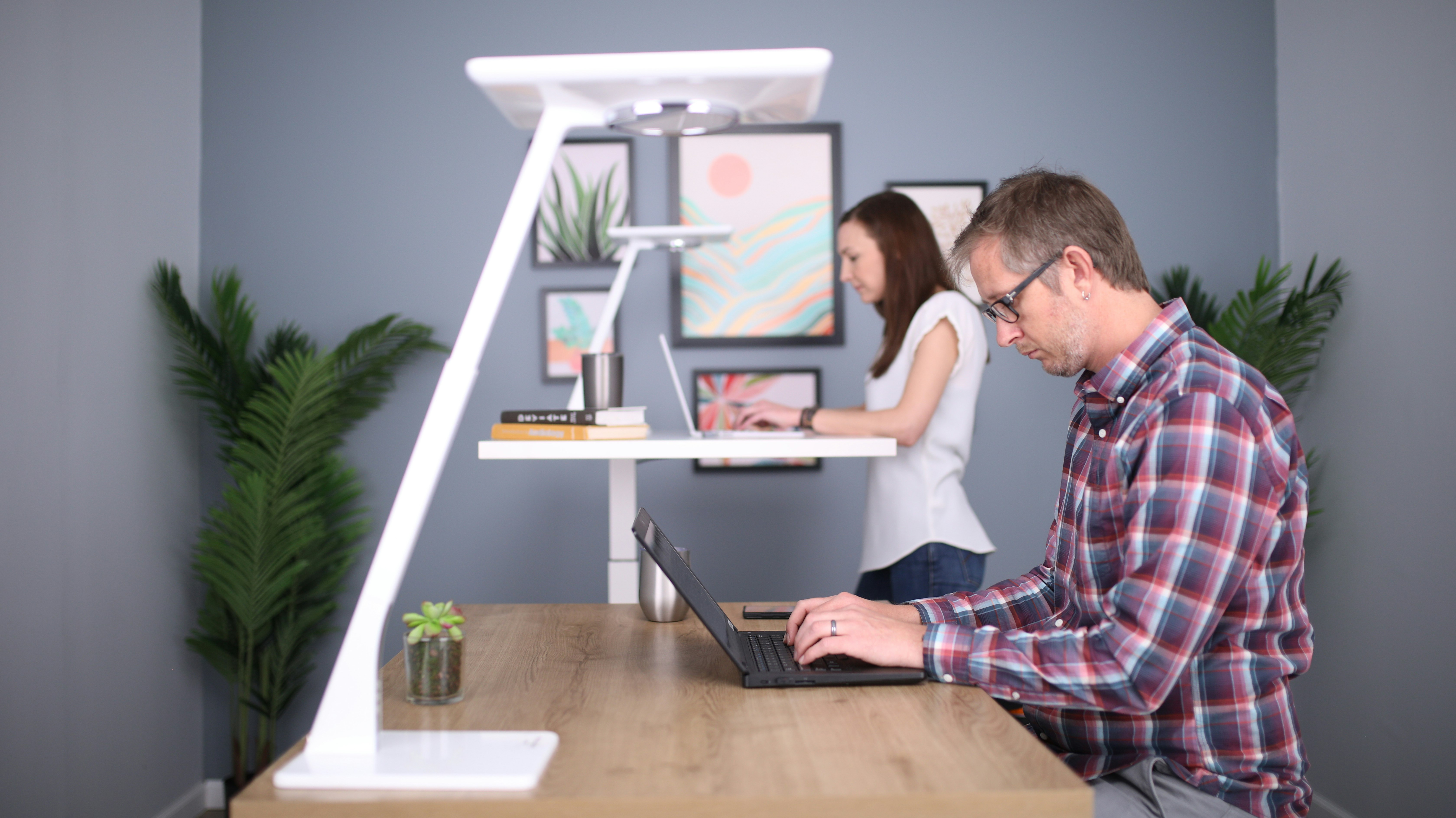 man in white crew neck t-shirt using black laptop computer