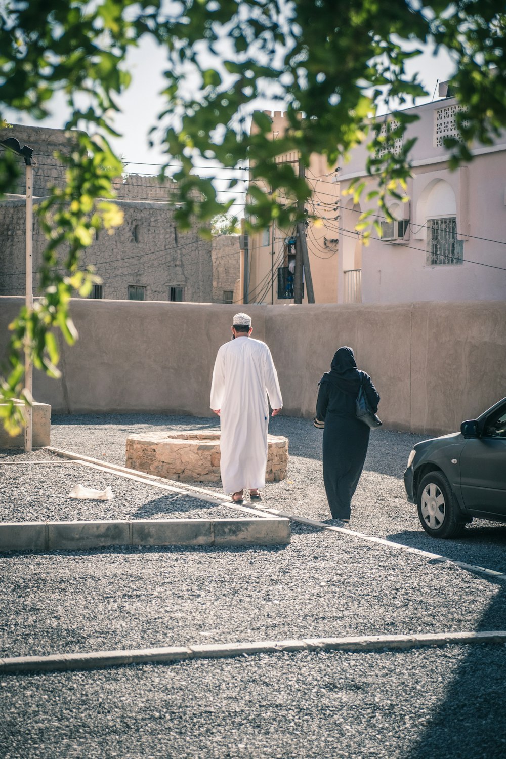 Man in white thobe standing beside black car during daytime photo ...